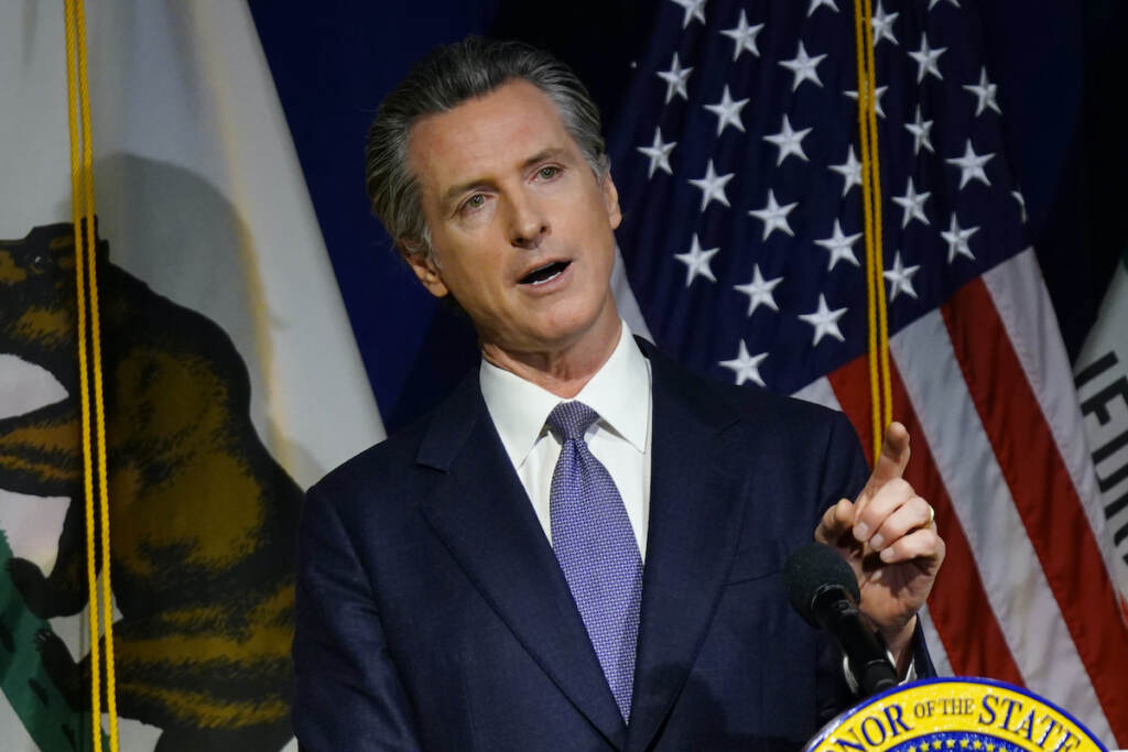 California Gov. Gavin Newsom speaks during a news conference in Sacramento, Calif., on Jan. 10, 2022. On Friday, Feb. 18, 2022, California Gov. Gavin Newsom announced legislation aimed at letting private citizens file lawsuits to enforce a ban on assault weapons. The bill is modeled after a Texas law that lets private citizens enforce a ban on abortions once a fetal heartbeat is detected