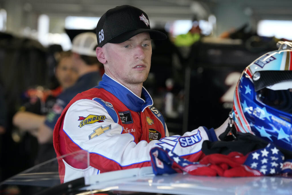 NASCAR Daytona Xfinity Auto Racing Brandon Brown moves his helmet after a NASCAR Xfinity Series auto race practice Friday, Feb. 18, 2022, at Daytona International Speedway in Daytona Beach, Fla. (AP Photo/Chris O'Meara)