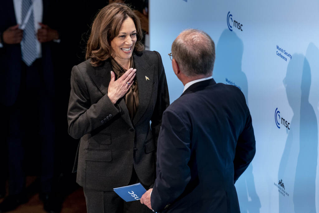 Germany Munich Security Conference Harris U.S. Vice President Kamala Harris is welcomed on stage to speak by Munich Security Conference Chairman Wolfgang Ischinger, right, during the Munich Security Conference, Saturday, Feb. 19, 2022, in Munich. (AP Photo/Andrew Harnik, Pool)