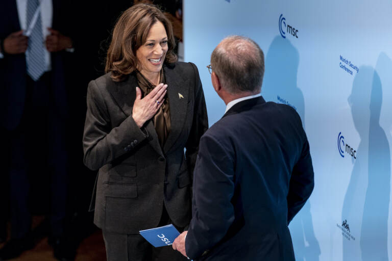 U.S. Vice President Kamala Harris is welcomed on stage to speak by Munich Security Conference Chairman Wolfgang Ischinger, right, during the Munich Security Conference, Saturday, Feb. 19, 2022, in Munich. (AP Photo/Andrew Harnik, Pool)
