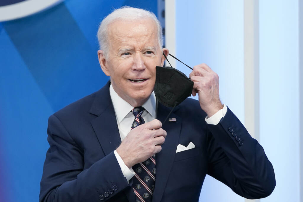Joe Biden President Joe Biden removes his face mask to speak in the South Court Auditorium in the Eisenhower Executive Office Building on the White House complex, Tuesday, Feb. 22, 2022, in Washington