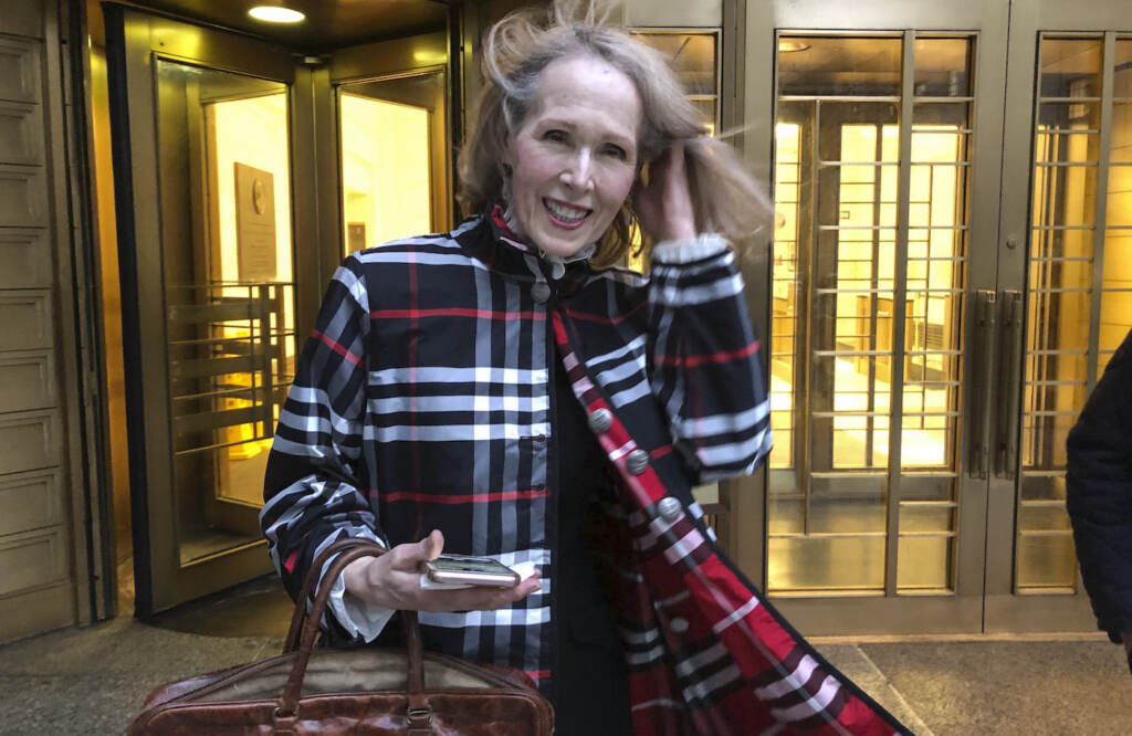 Trump Columnist Lawsuit Columnist E. Jean Carroll leaves federal court Tuesday Feb. 22, 2022, in New York. Carroll, who accused former President Donald Trump of raping her in the mid-1990s and then filed a defamation lawsuit against him, will not seek to depose him prior to trial because it would cause unnecessary delay, but she added that a DNA sample was still being sought. (AP Photo/Larry Neumeister)