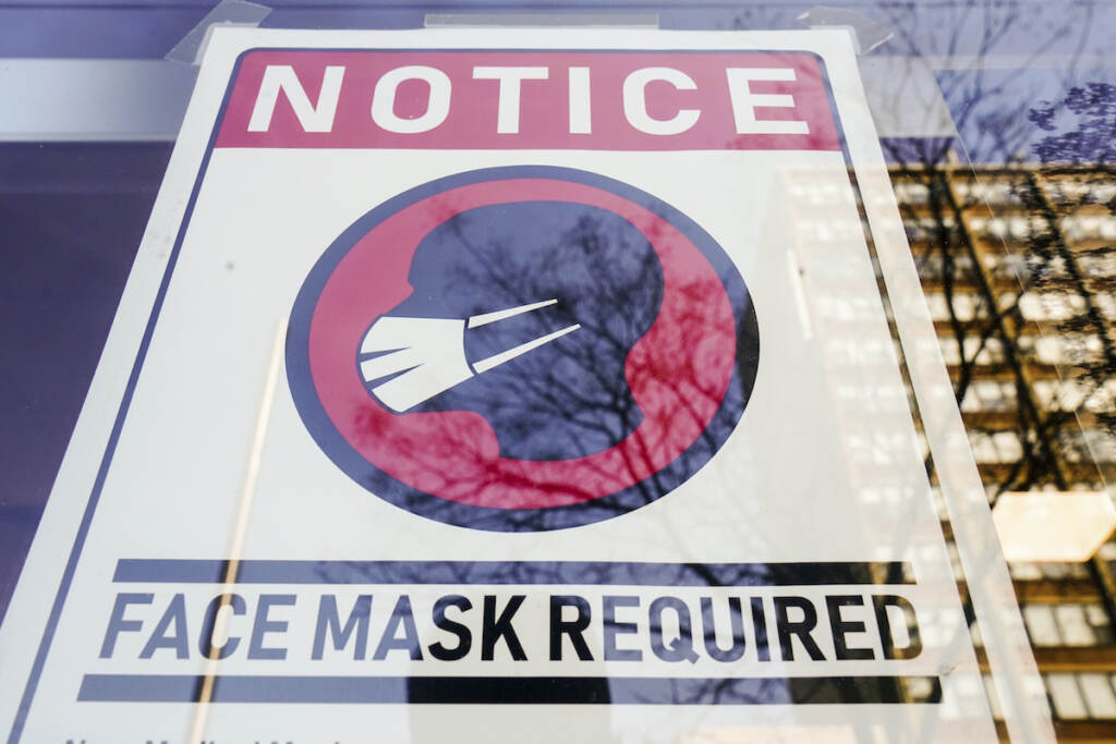 Virus Outbreak Masks File photo: A sign requiring masks as a precaution against the spread of the coronavirus is posted on a store front in Philadelphia, on Feb. 16, 2022. (AP Photo/Matt Rourke, File)