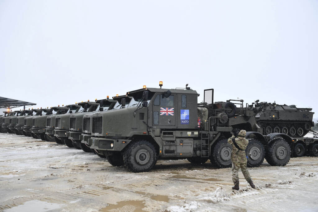 Estonia Ukraine Invasion Tanks uploaded on military truck platforms as a part of additional British troops and military equipment arrive at Estonia's NATO Battle Group base in Tapa, Estonia, Friday, Feb. 25, 2022. With Ukrainian President Volodymyr Zelenskyy appealing for help, NATO members ranging from Russia’s neighbor Estonia in the north down to Bulgaria on the Black Sea coast triggered urgent consultations about their security