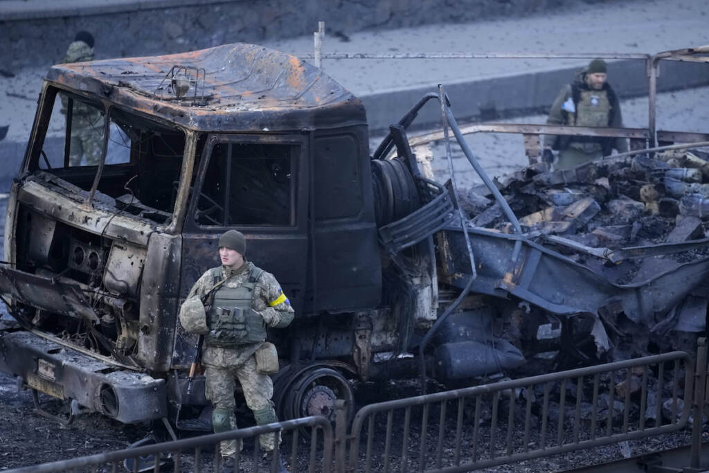 APTOPIX Ukraine Invasion Ukrainian troops inspect the site following a Russian airstrike in Kyiv, Ukraine, Saturday, Feb. 26, 2022