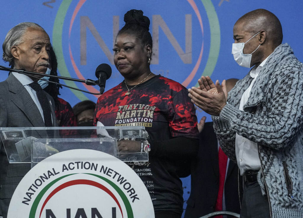 Trayvon Martin Anniversary Rev. Al Sharpton, left, president of the National Action Network (NAN), and Mayor Eric Adams, right, stand next to Sybrina Fulton, center, the mother of Trayvon Martin, as she address a rally commemorating the 10th anniversary of her son’s killing, Saturday Feb. 26, 2022, at NAN’s Harlem headquarters in New York. “Today is a bittersweet day,” said Fulton, who with her family created the Trayvon Martin Foundation to raise awareness of gun violence