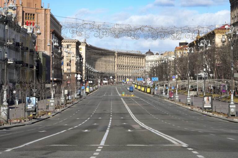 A view of Khreshchatyk, the main street, empty, due to curfew in the central of Kyiv, Ukraine, Sunday, Feb. 27, 2022. A Ukrainian official says street fighting has broken out in Ukraine's second-largest city of Kharkiv. Russian troops also put increasing pressure on strategic ports in the country's south following a wave of attacks on airfields and fuel facilities elsewhere that appeared to mark a new phase of Russia's invasion. (AP Photo/Efrem Lukatsky)