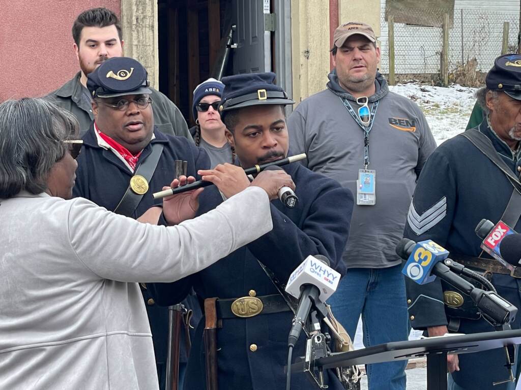 Steve Thomas, a member of the 6th Regiment U.S. Colored Troops, Reenactors, play the Battle Hymn of the Republic on the fife
