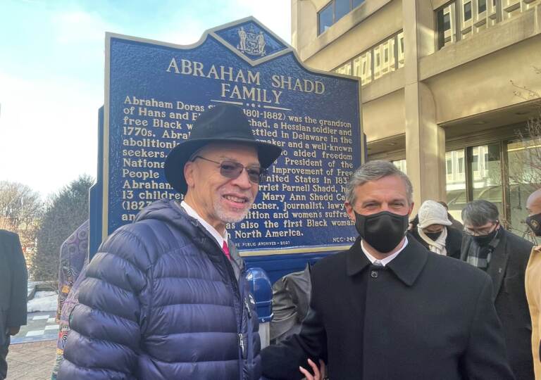 Janmichael Shadd Graine (left) with Gov. John Carney, stands at the new historic marker honoring his great great great great grandfather. (Cris Barrish/WHYY)