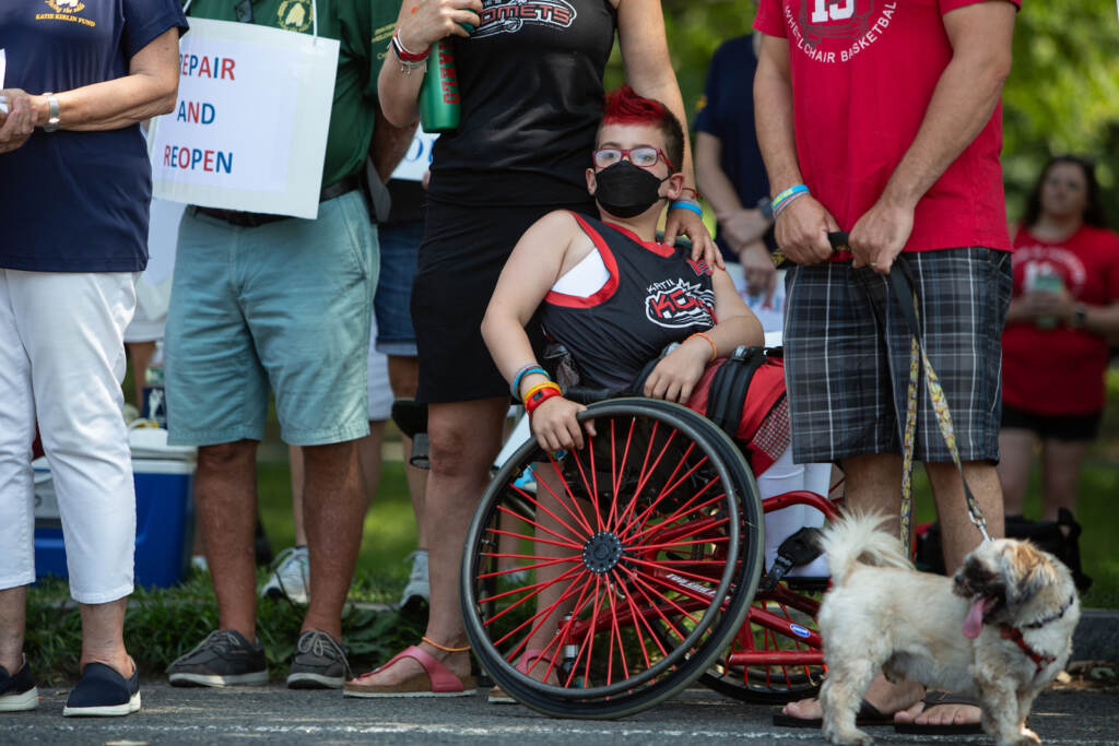 carouselhouse-protest08 A Katie's Komets player sits in a wheelchair at a protest