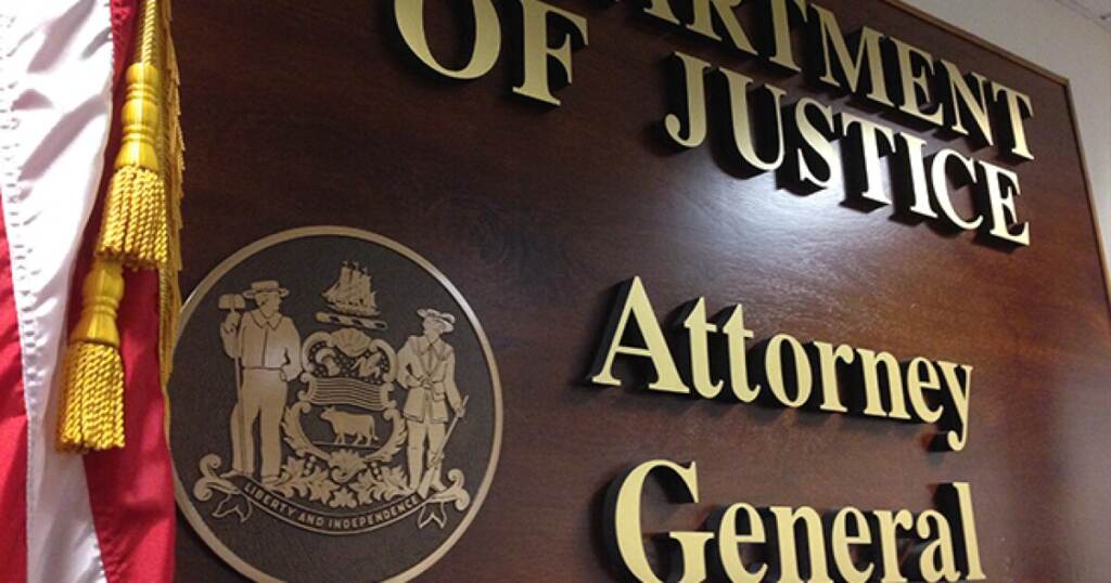 delaware department of justice state of delaware A sign on the wall for the Delaware DOJ