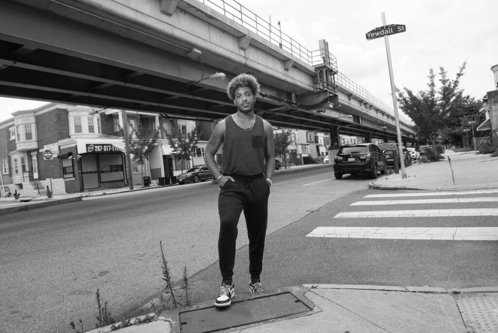 Eli Cappella stand on a street corner in Philly