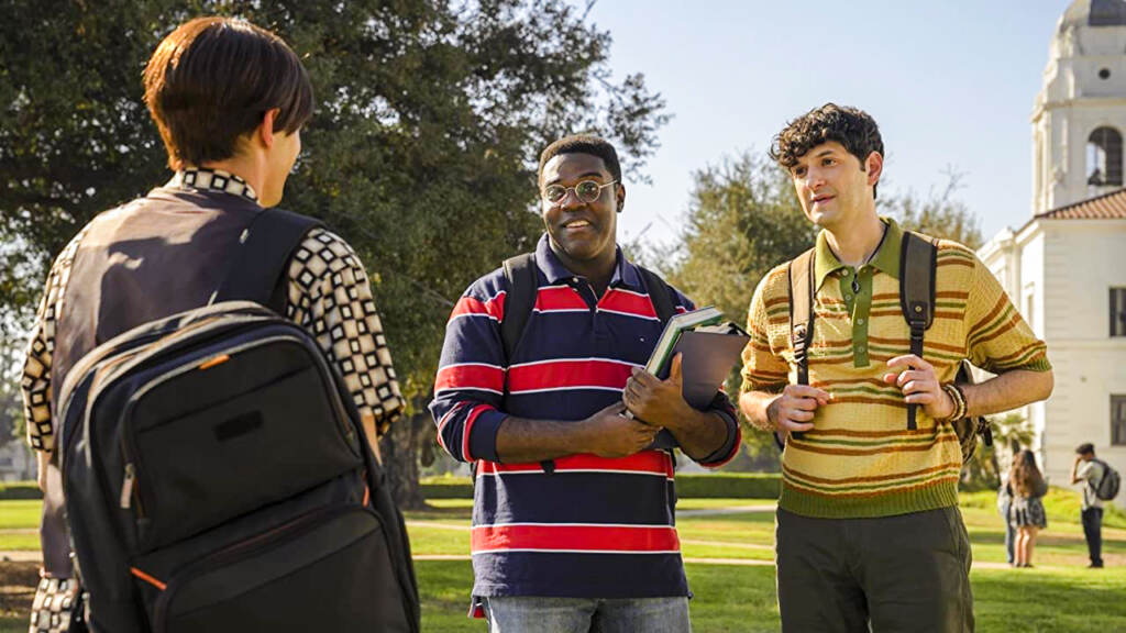 flicks-afterparty Ben Schwartz and Sam Richardson standing outside a school with backpacks on talking to another student in The Afterparty