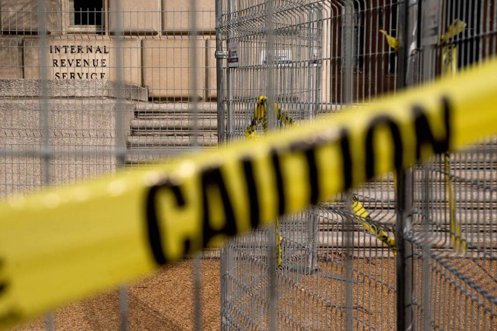 US-POLITICS-GOVERNMENT-TAXES The outside of an IRS building, surrounded by caution tape.