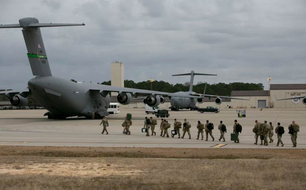 U.S. troops depart Fort Bragg, N.C., Thursday for deployment in Europe as part of the U.S. response to the tensions around Ukraine. US troops deploy for Europe from Pope Army Airfield at Fort Bragg, North Carolina, on February 3, 2022. (Photo by Allison Joyce / AFP) (Photo by ALLISON JOYCE/AFP via Getty Images)