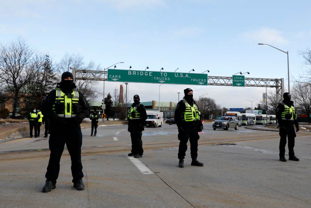 Police from London, Ontario, block protesters from the Ambassador Bridge on Saturday. Police from London, Ontario, block protesters from the Ambassador Bridge on Saturday.
(Jeff Kowalsky/AFP via Getty Images)