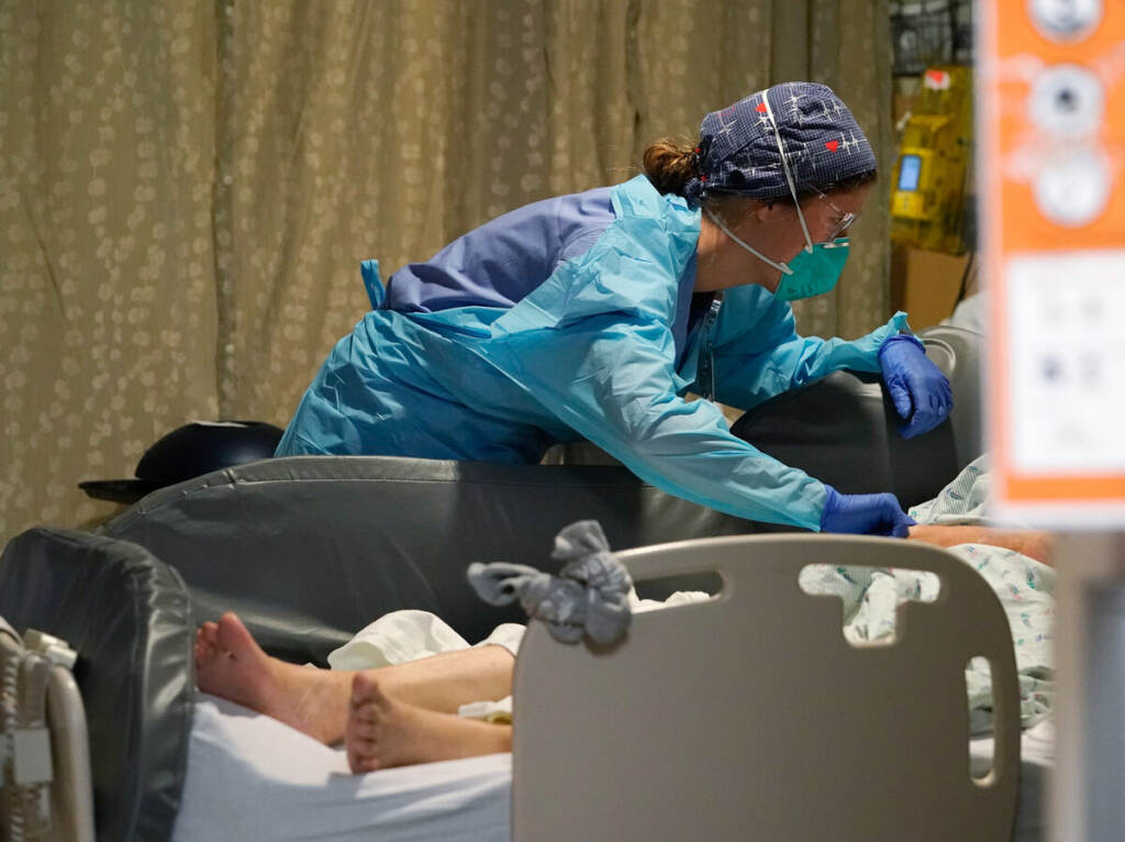 APTOPIX Virus Outbreak Washington Estella Wilmarth tends to a patient in the acute care unit