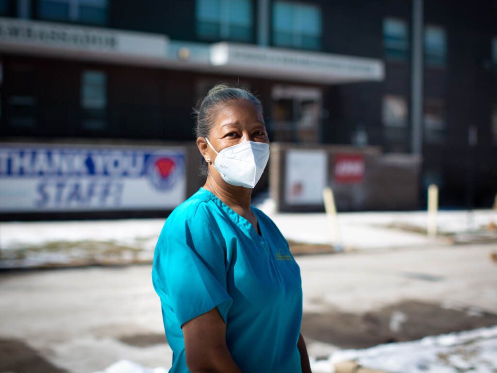 Pat Johnson wears a face mask outside