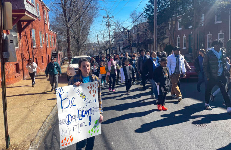 Marchers walk for peace and unity on the West Side of Wilmington. (Cris Barrish/WHYY)