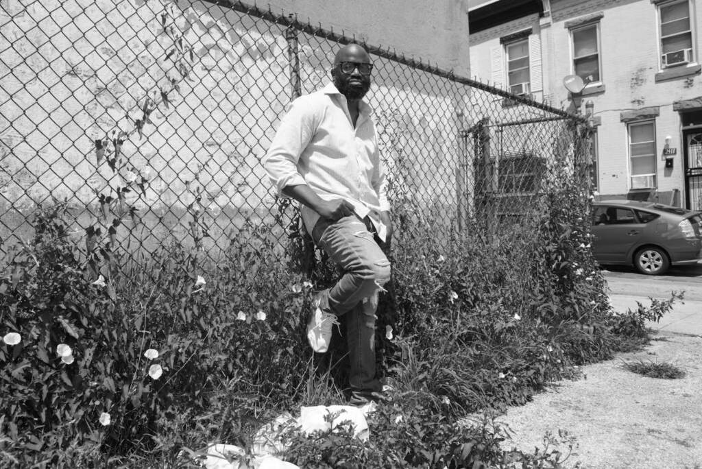 sadiq-sellers-RG-01-020922 Sadiq Sellers leans against a fence in Philly