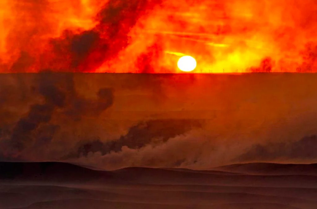 smoke fire sunset ap The setting sun is shrouded in smoke from a fire that burned and stretched across Ellis, Russell, Osborne and Rooks counties Thursday, Dec. 16, 2021, near Natoma, Kansas.
(AP Photo/Charlie Riedel)
