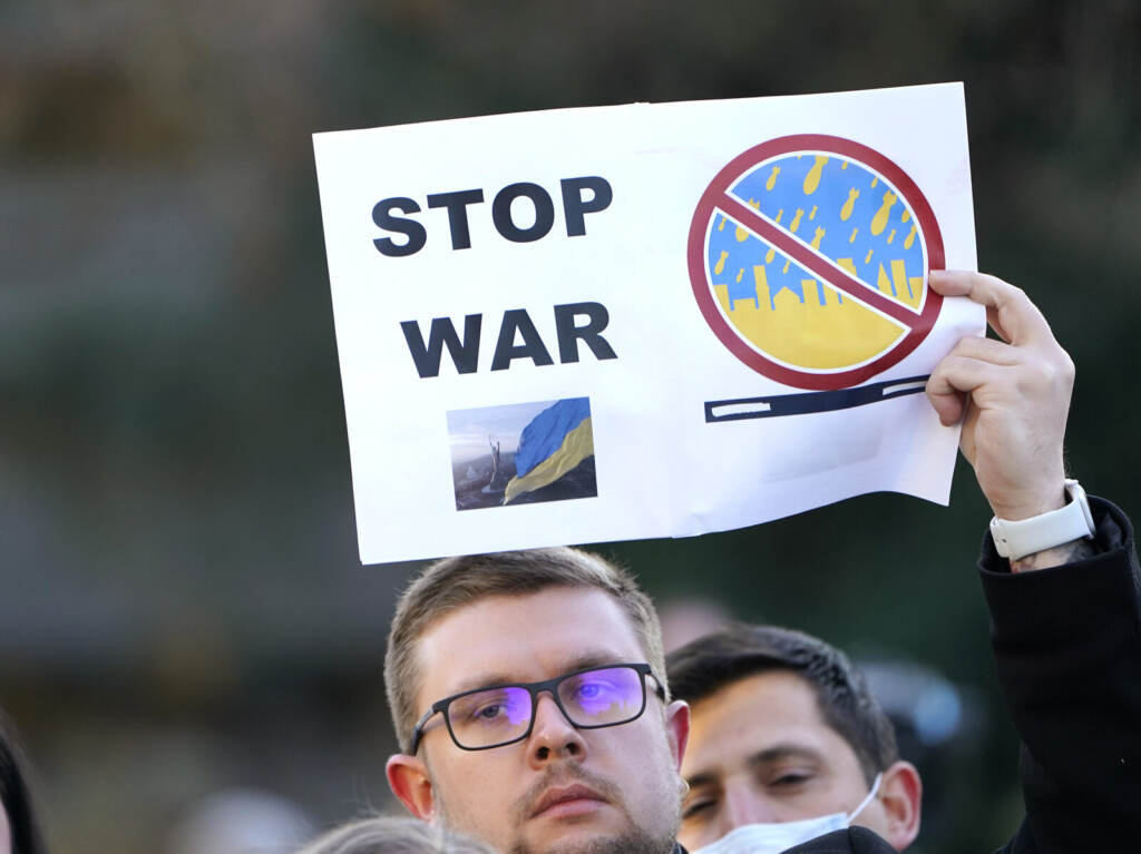 Ukraine Tensions Washington A protester holds up a sign that says