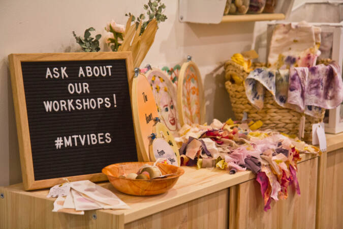 A sign inside Modest Transitions says, ''Ask about our workshops''