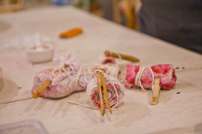 Fabrics are bundled for a steam bath at a natural dyeing workshop