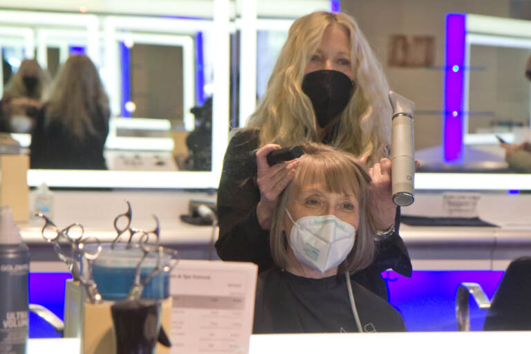Judy Kozulak has her hair cut and styled