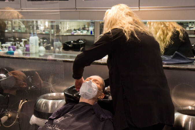 Judy Kozulak had her hair cut and styled for the first time since the COVID-19 pandemic started by stylist Lorraine Keane at Perry Anthony Salon & Spa in Wilmington, Del., on March 14, 2022. Kouzulak is severely immunocompromised, and hasn’t been inside public spaces since 2020. (Kimberly Paynter/WHYY)