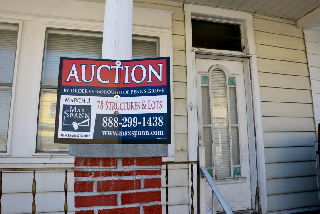 2022 03 16-e lee-penns grove nj 58 w pitma street-foreclosed home auction A home at 58 West Pitman Street in Penns Grove, with an auction sign in front of it