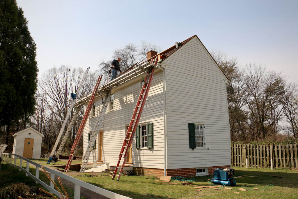2022 03 22-lawnside nj peter mott house-underground railroad museum repairs Roofers make repairs to the historic Peter Mott House in Lawnside, N.J. The home was a station along the Underground Railroad and serves as a museum and home to the Lawnside Historical Society. (Emma Lee/WHYY)