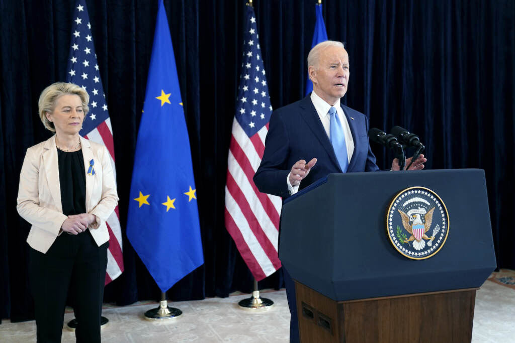 Joe Biden,Ursula von der Leyen President Joe Biden speaks at a podium, with European Commission President Ursula von der Leyen standing in the background.