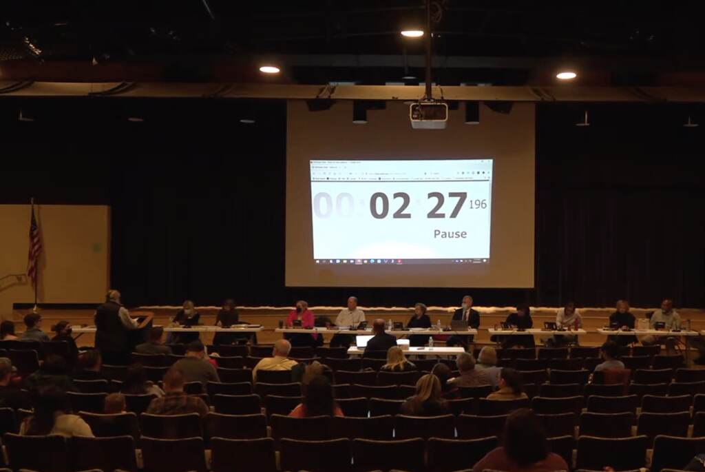 2022-03-28-westchester-school-district-privacy Resident Jenifer MacFarland (pictured far left at the podium) makes a public comment — and hand delivers a Right to Know Law request to the West Chester Area School District seeking information on LGBTQ students