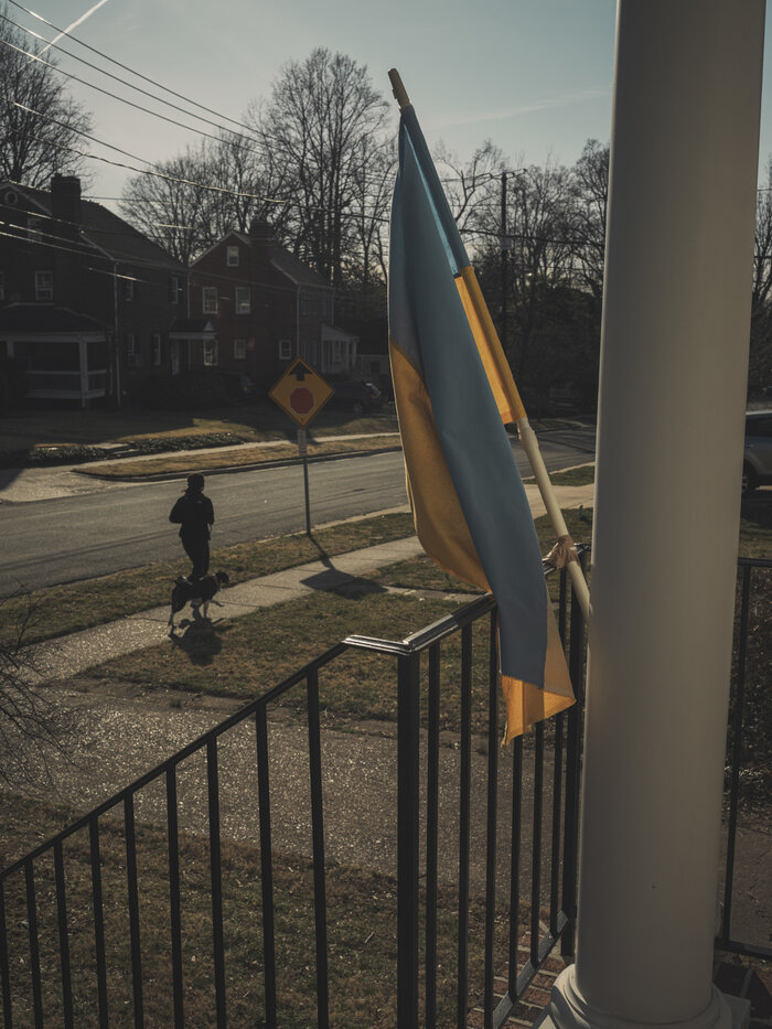 A Ukraine flag is hung outside a home
