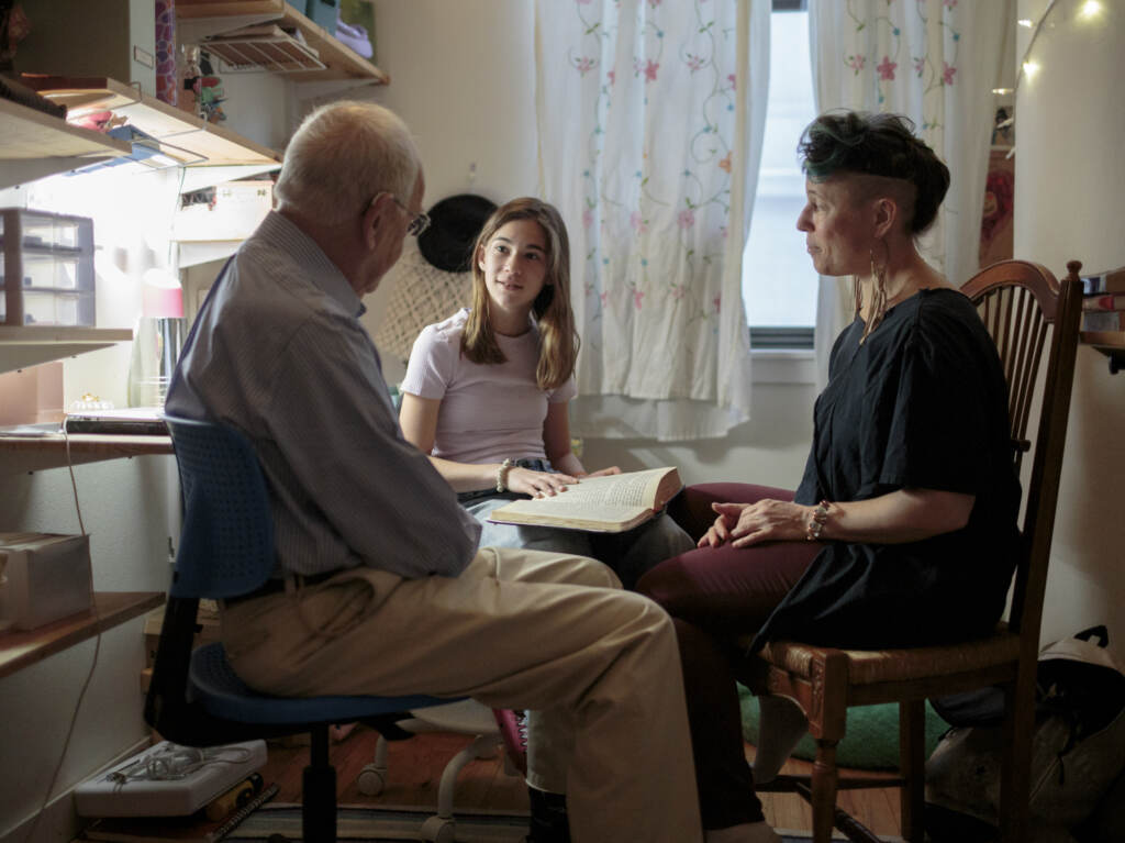 Nomi Kline Solmeson prepares for her bat mitzvah, reading the Torah in her bedroom with her grandfather, Rabbi David Kline, and her aunt Shira Kline. Nomi Kline Solmeson prepares for her bat mitzvah, reading the Torah in her bedroom with her grandfather, Rabbi David Kline, and her aunt Shira Kline.