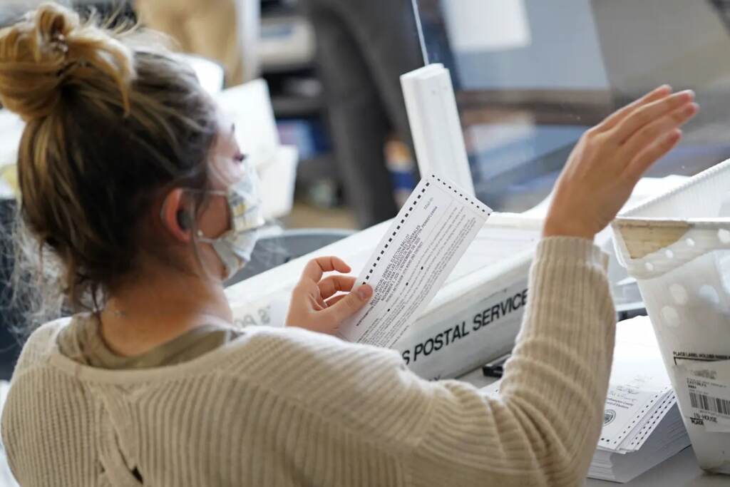 Mail-in ballots are sorted and counted by workers on Election Day 2020 at Northampton County Courthouse. (Matt Smith for Spotlight PA)