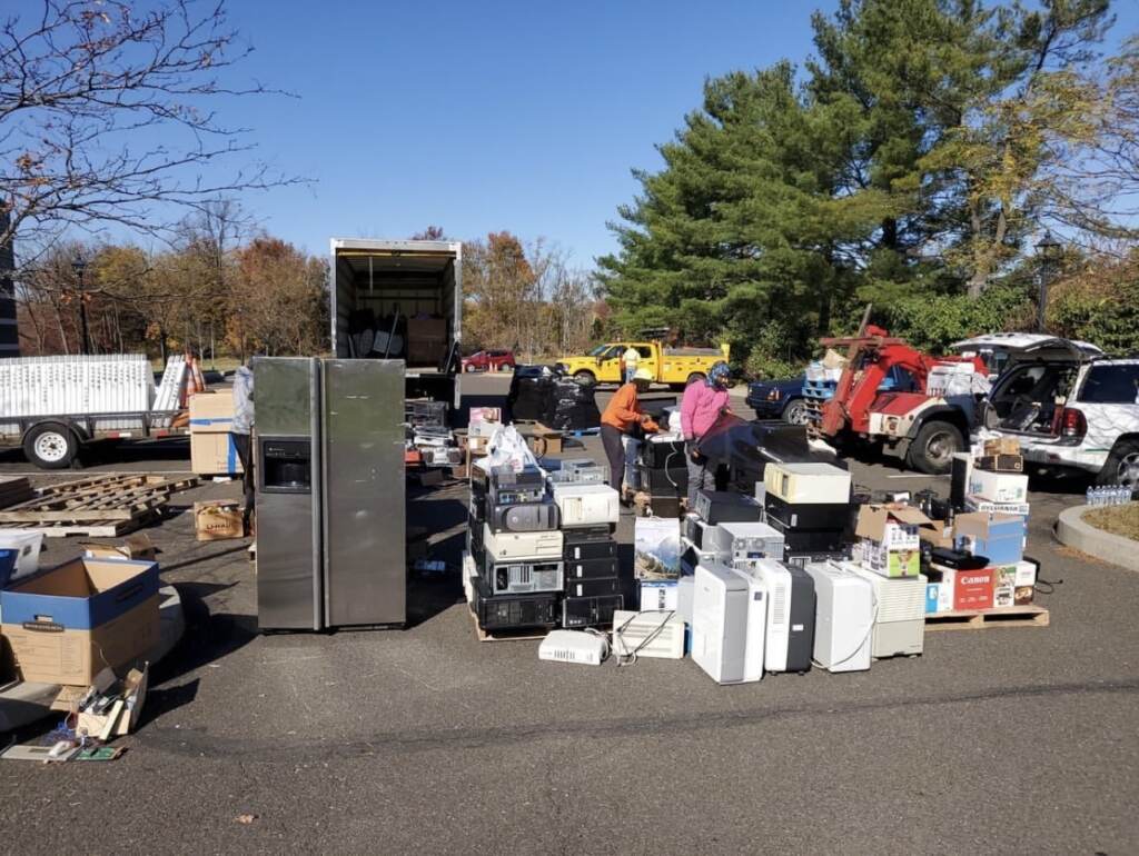 76FAB07E-3438-497F-8C1A-1D120374E5EE_1_201_a A group of employees collect e-waste at PAR-Recycle in North Philadelphia.