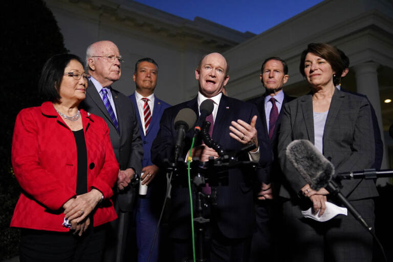 Sen. Chris Coons, D-Del., center, speaks with reporters after he and Democratic members of the Senate Judiciary Committee met with President Joe Biden to discuss the upcoming Supreme Court vacancy, Thursday, Feb. 10, 2022, at the White House in Washington. (AP Photo/Patrick Semansky)