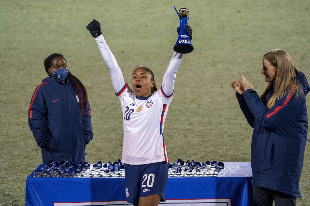 U.S. forward Catarina Macario holds up the SheBelieves Cup MVP trophy after the team's 5-0 victory over Iceland in a soccer match Wednesday, Feb. 23, 2022, in Frisco, Texas