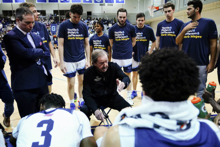 Jefferson coach Herb Magee speaks with his team during an NCAA college basketball game against USciences, Wednesday, Feb. 23, 2022, in Philadelphia. Thomas Jefferson University coach Herb Magee has retired after a Hall of Fame career. Magee went 1,144-450 in 54 seasons at Thomas Jefferson University.