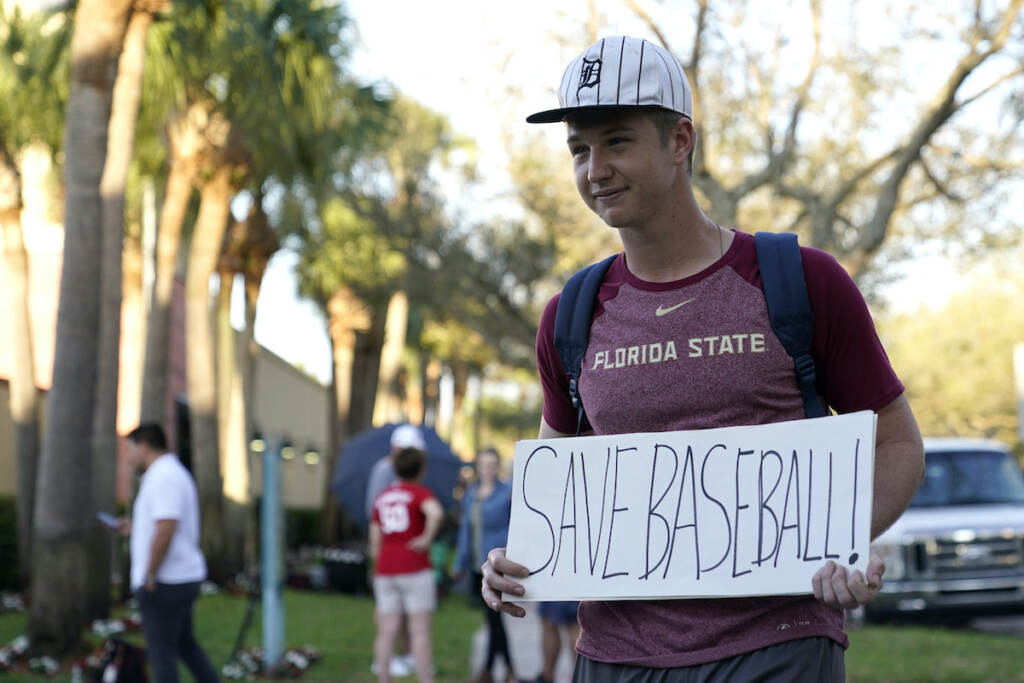 Noah McMurrain Baseball fan Noah McMurrain of Boynton Beach, Fla., stands outside Roger Dean Stadium as Major League Baseball negotiations continue in an attempt to reach an agreement to salvage a March 31 start to the regular season, Monday, Feb. 28, 2022, in Jupiter, Fla. (AP Photo/Lynne Sladky)