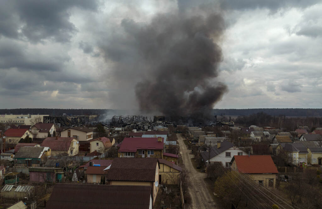 Russia Ukraine War A factory and a store burn after being bombarded in Irpin, on the outskirts of Kyiv, Ukraine, Sunday, March 6, 2022. (AP Photo/Emilio Morenatti)