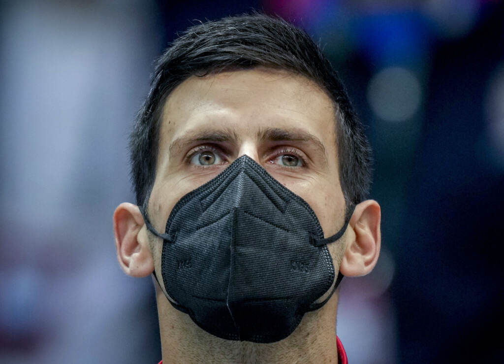 File photo: Serbia’s Novak Djokovic wears a face mask as he listens to the national anthems prior to a Davis Cup group F match between Serbia and Austria in Innsbruck, Austria, Friday, Nov. 26, 2021. (Photo/Michael Probst)
