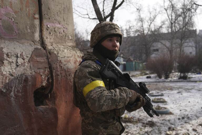A Ukrainian serviceman guards his position in Mariupol, Ukraine, Saturday, March 12, 2022. Ukraine’s military says Russian forces have captured the eastern outskirts of the besieged city of Mariupol. In a Facebook update Saturday, the military said the capture of Mariupol and Severodonetsk in the east were a priority for Russian forces. Mariupol has been under siege for over a week, with no electricity, gas or water