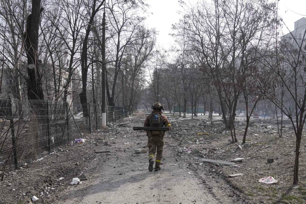 APTOPIX Russia Ukraine War A Ukrainian serviceman walks near the position he was guarding in Mariupol, Ukraine, Saturday, March 12, 2022. Ukraine’s military says Russian forces have captured the eastern outskirts of the besieged city of Mariupol. In a Facebook update Saturday, the military said the capture of Mariupol and Severodonetsk in the east were a priority for Russian forces. Mariupol has been under siege for over a week, with no electricity, gas or water