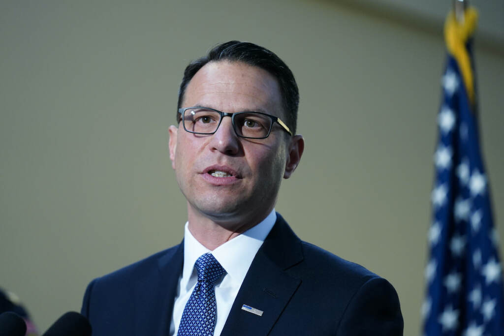 Pennsylvania Attorney General Josh Shapiro speaks with members of the media during a news conference, in Philadelphia, Tuesday, March 15, 2022. (AP Photo/Matt Rourke)