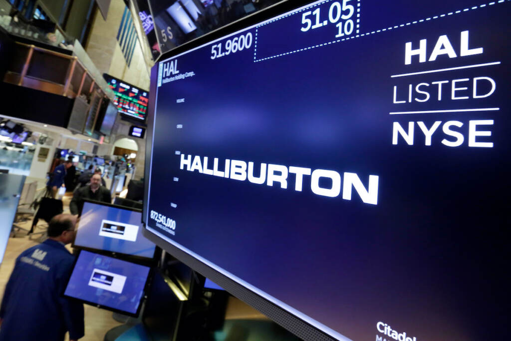 US-Russia-Ukraine-War-Oil File photo: The logo for Halliburton appears above a trading post on the floor of the New York Stock Exchange, Monday, April 23, 2018. U.S. oil field services companies Halliburton Co. and Schlumberger are suspending their operations in Russia as the Houston, Texas-based businesses react to U.S. sanctions over Russia’s invasion of Ukraine