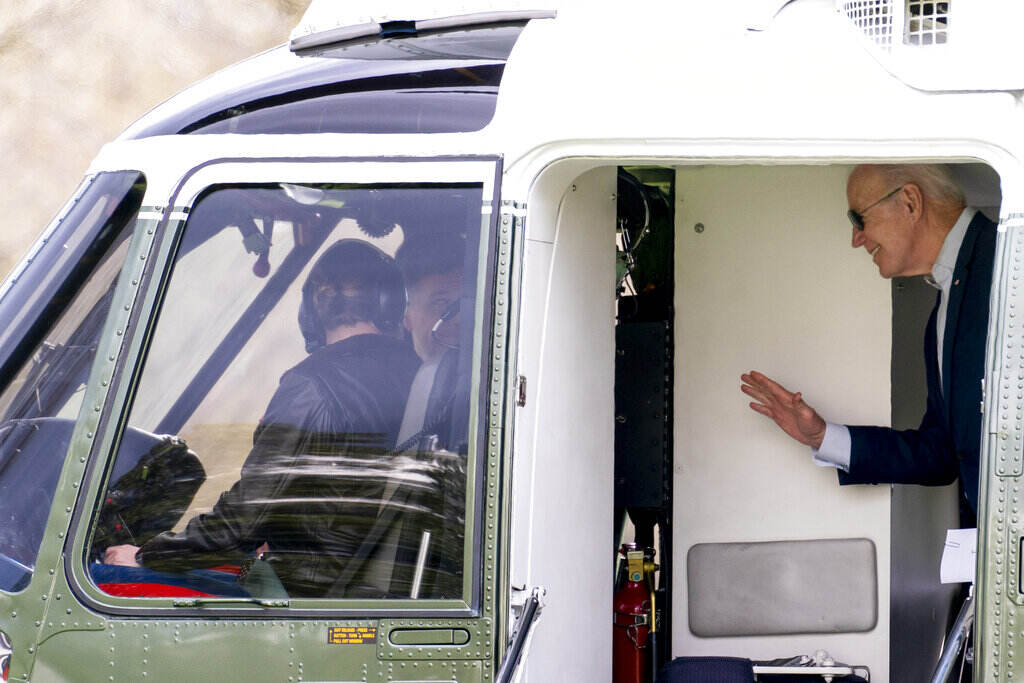 Joe Biden President Joe Biden waves to the pilots on Marine One as he arrives at the White House in Washington, Sunday, March 20, 2022, after spending the weekend in Rehoboth Beach, Del.