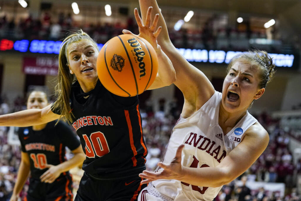 Ellie Mitchell, Grace Stone Princeton forward Ellie Mitchell (00) and Indiana forward Aleksa Gulbe (10) reach for the ball as they go for a long rebound in the second half of a college basketball game in the second round of the NCAA tournament in Bloomington, Ind., Monday, March 21, 2022. Indiana defeated Princeton 56-55. (AP Photo/Michael Conroy)